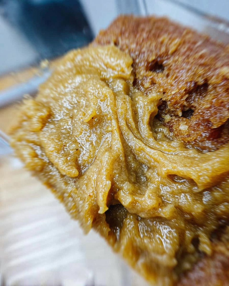 Pale and puffy soft batch cookies cooling on a baking sheet