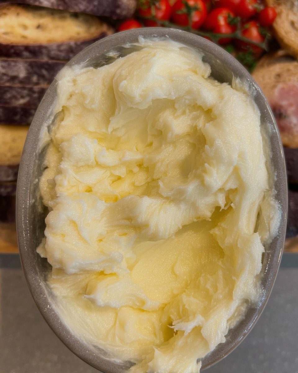 Ingredients for thumbprint cookies including butter sugar and jam