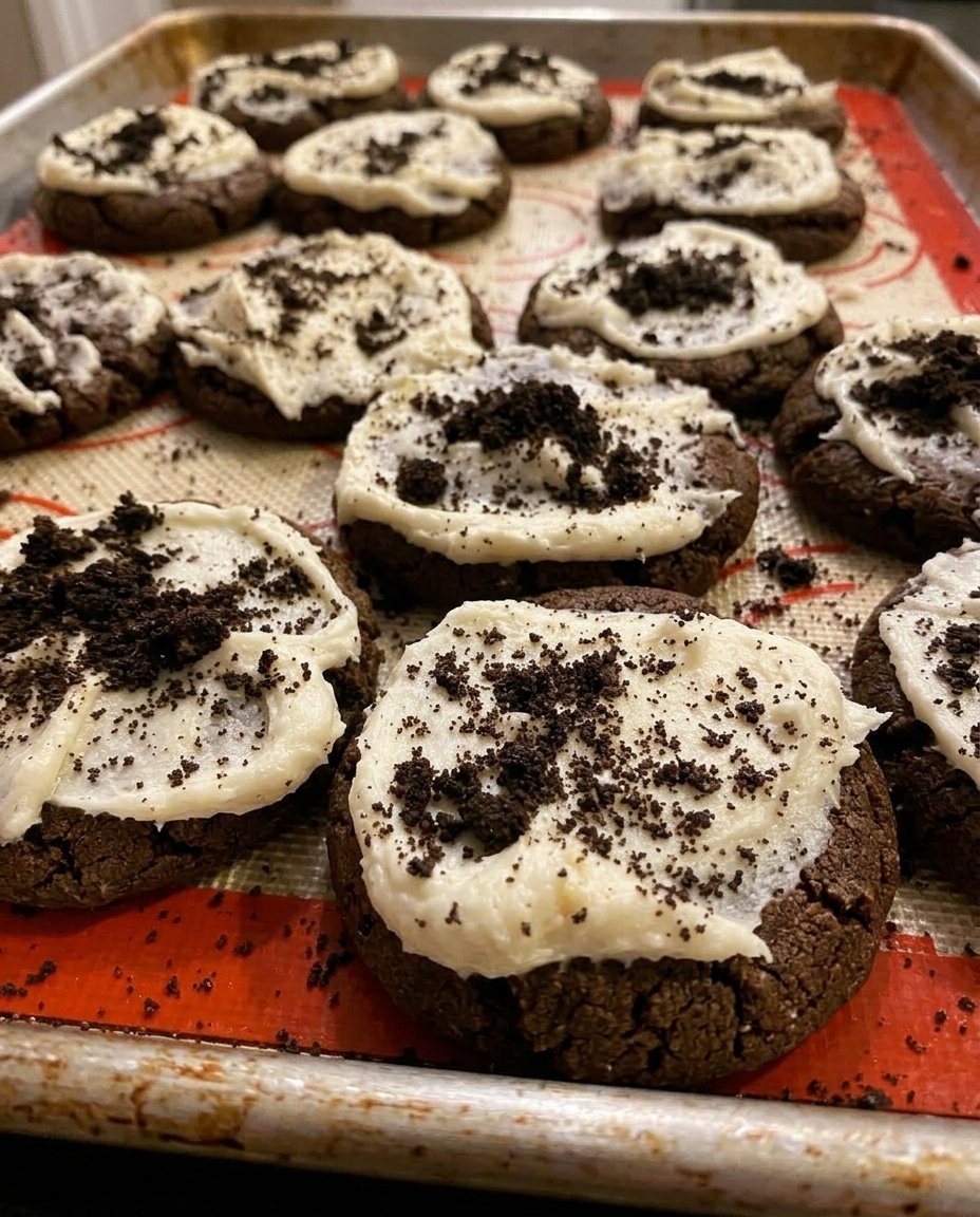 Homemade Oreo copycat cookies stacked in a vintage glass jar