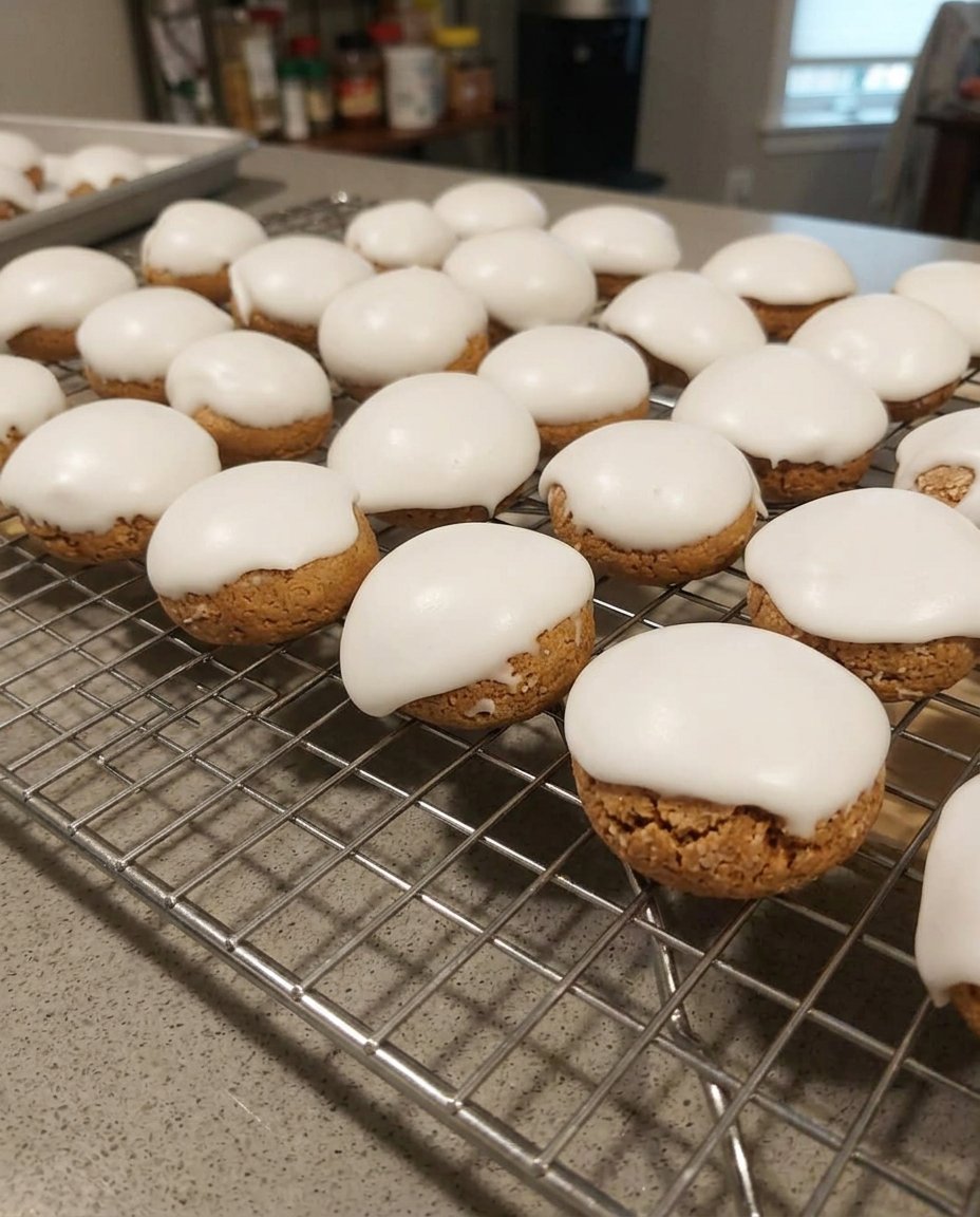 Glazed spice cookies served with a cup of hot tea.