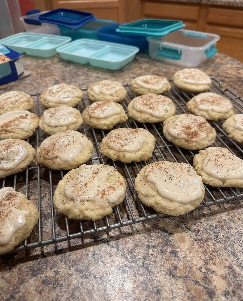 A plate of iced Taylor Swift Chai Cookies on a wooden table