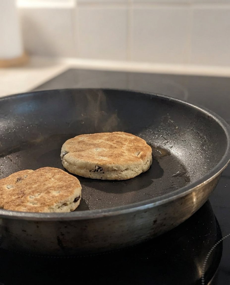 Ingredients for Welsh cakes including flour, soft butter, and rehydrated raisins.