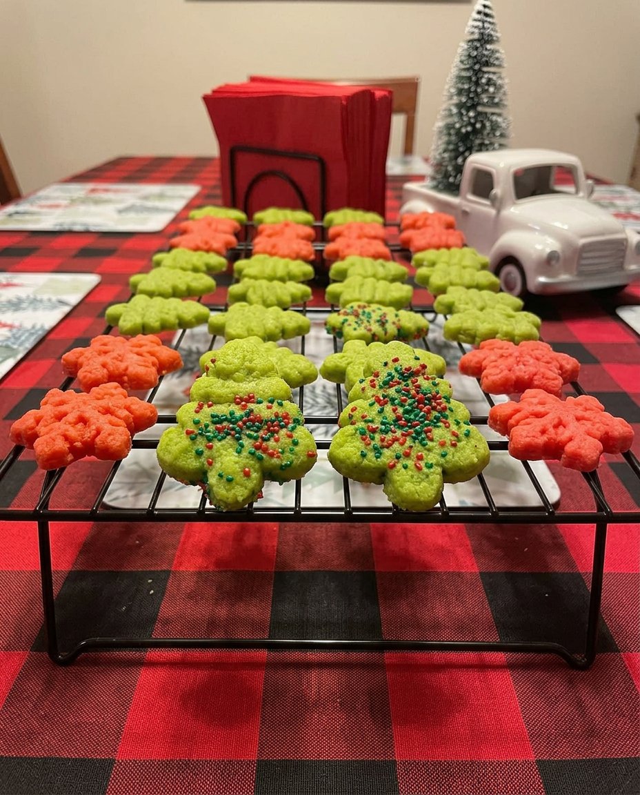A festive platter of colorful red, green, and white spritz cookies ready for sharing