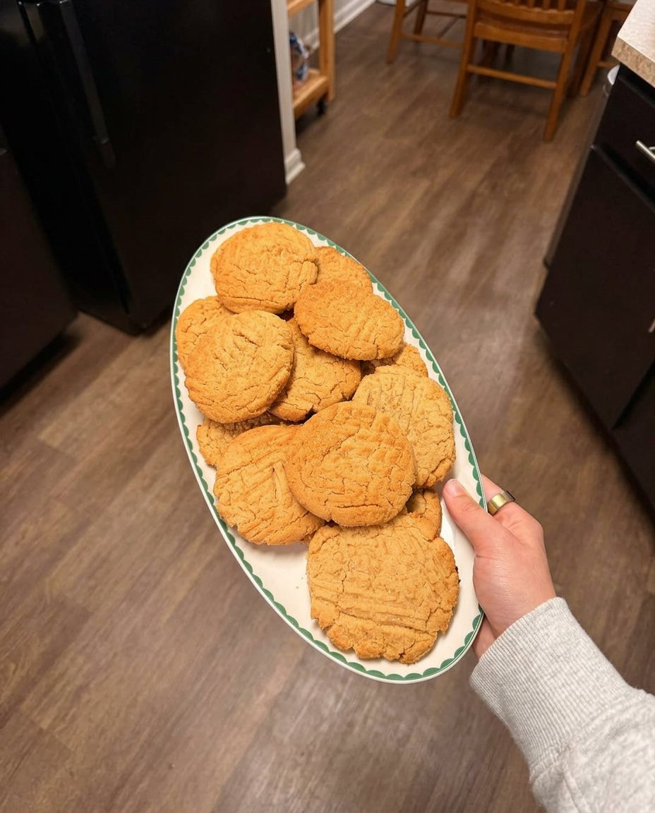 Soft chewy 3 ingredient peanut butter cookies stacked in a vintage glass jar